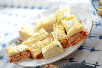 Close up of served salt cake with yellow cheese