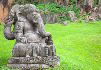 Fototapeta na wymiar Ganesha statue in a beautiful mountain garden