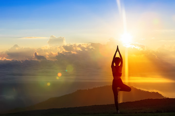 Young woman in a meditating yoga on the beautiful morning. healthy lifestyle.