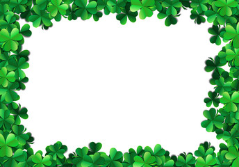 Saint Patricks day background with sprayed green clover leaves or shamrocks