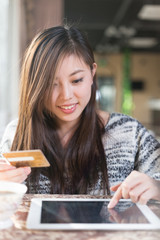 young pretty woman sits in cafe