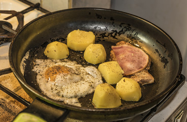 Chicken meat with potatoes and egg