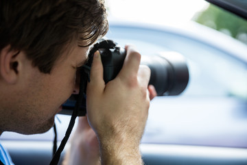 Man Photographing With SLR Camera