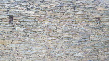 grey natural rough granite stone wall texture beautiful background.