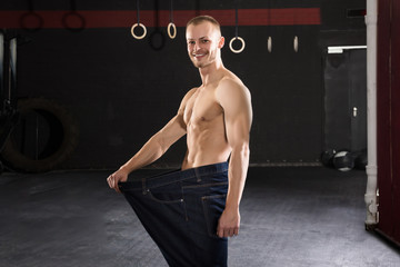 Fototapeta na wymiar Man Wearing Loose Jean In The Gym