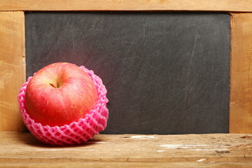 The apple with pink color absorber foam wrap up represent the fruit concept related idea.