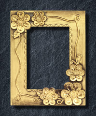 gold frame on black slate background