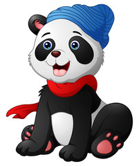 Fototapeta premium Cute cartoon panda sitting wearing a red scarf and a blue hat