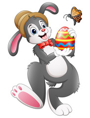 Cartoon bunny holding Easter egg with butterfly