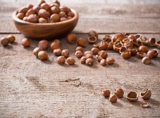 Hazelnuts on wooden background