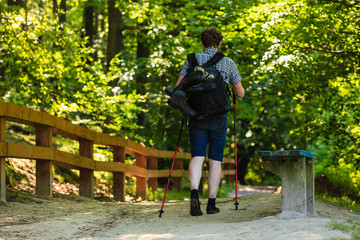 Obraz premium Young man alone in woodland.