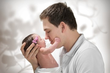 Dad and newborn daughter