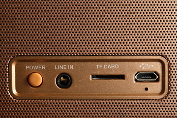 The backside of the loudspeaker shown the power button represent the speaker and sound device concept related idea.