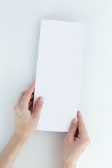 White paper folder lying on table