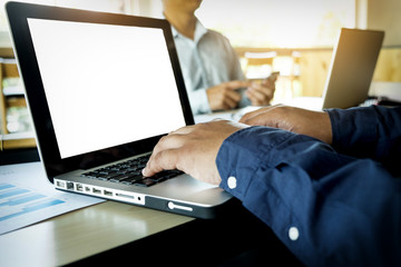 Team work process. young business managers crew working with new startup project. labtop on wood table, typing keyboard, texting message, analyse graph plans