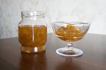 Gooseberry jam in a glass jar and kremanke.