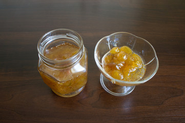 Gooseberry jam in a glass jar and kremanke.