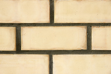 Yellow brick wall close-up