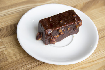 Piece of chocolate cake with nuts