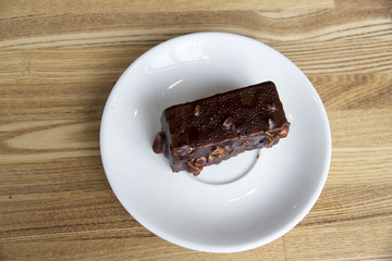 Portion of chocolate cake on plate