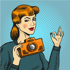 Vector illustration of woman taking photo in pop art style.