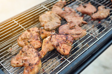 Grilled chicken thigh on the charcoal stove