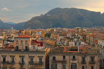View from the roof of Palermo Cathedral. You can see amazing cityscape of Palermo. Beautiful tiled roofs of old houses. Nice mountain in the background. Palermo. Sicily