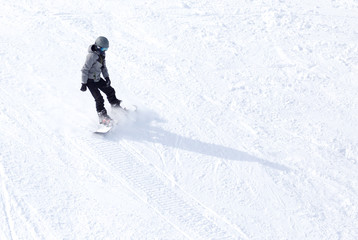 man snowboarding in winter