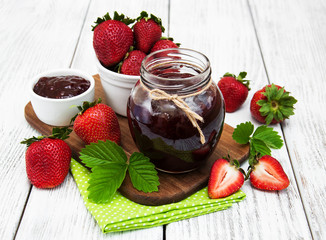 Strawberry jam and fresh strawberries