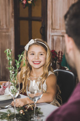 Cute girl at holiday table