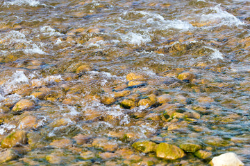 stones in the river as a backdrop