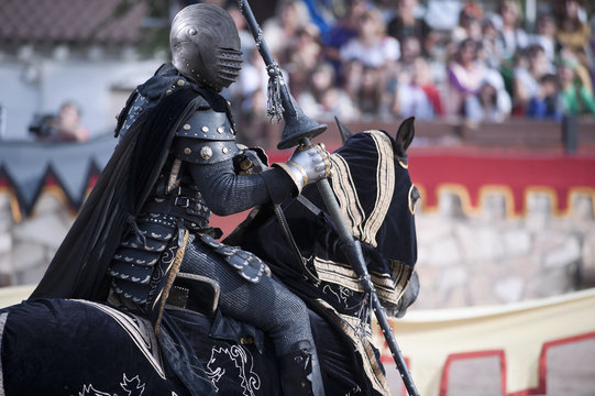 Portrait of a knight in armor, during the celebration of a medieval tournament