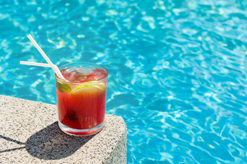 cocktail glass at pool with copy space