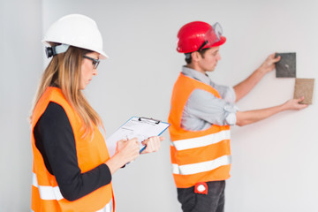 Architects examining tiles