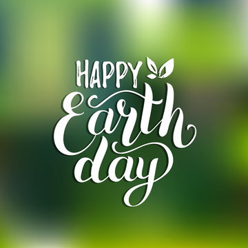 Happy Earth Day hand lettering card on blurred background. Vector illustration with leaves for banner, poster.