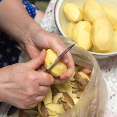 chef peeling potatoes