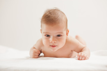 Cute baby lying on table