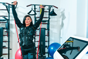 The female athlete doing they exercise in a ems fitness studio