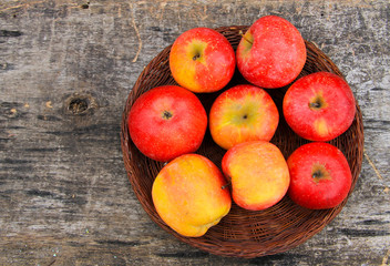 Red apples on wooden background