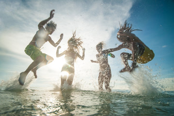 young people having fun in the sea
