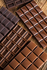Bars Chocolate , candy sweet, dessert food on wooden background
