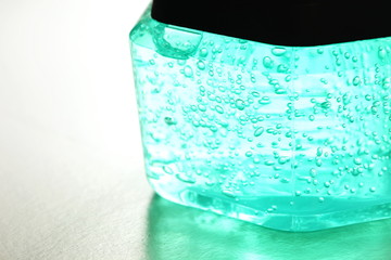 The hair styling gel clear bottle with black color lid represent the beauty and hair make up concept related idea.