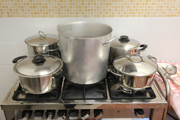 pots in the industrial kitchen on the stove inside the restauran