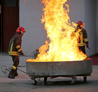 brave firefighters during the test of a fire extinguishing