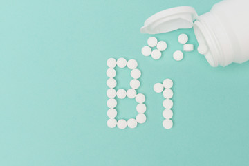 Bottle with Vitamin B1 Pills Forming the Word 'B1'