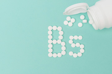 Bottle with Vitamin B5 Pills Forming the Word 'B5'