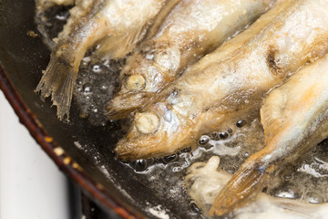 capelin in the flour fried in a pan