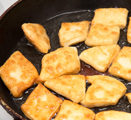 donuts fried in a pan