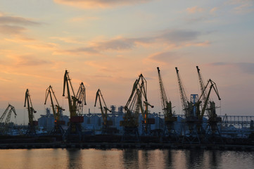 Obraz premium Port cargo crane at sunset
