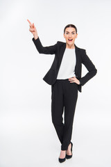 Surprised businesswoman pointing